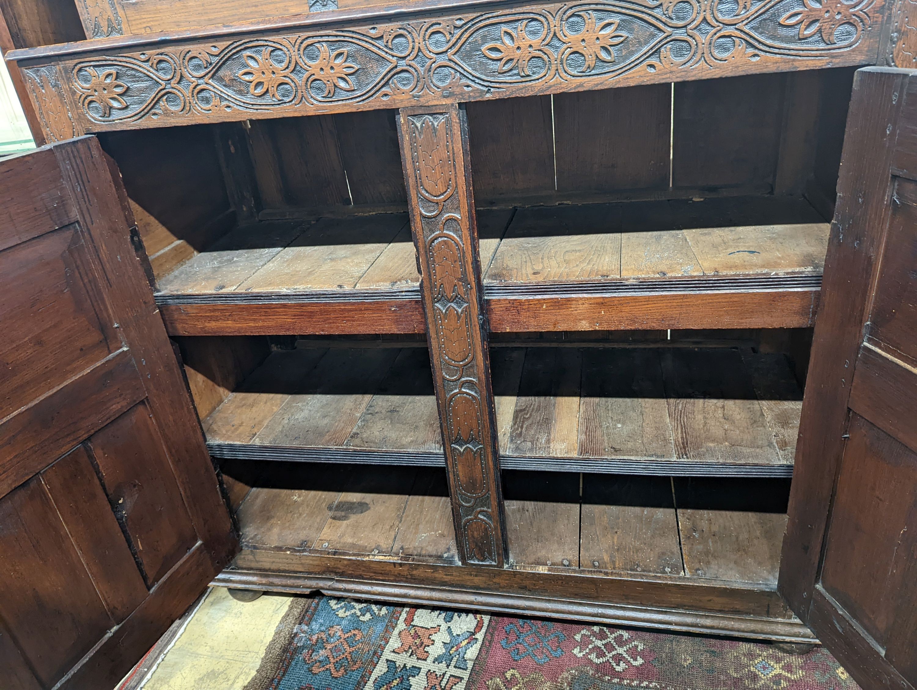 A 17th century and later oak court cupboard, width 129cm, depth 50cm, height 180cm